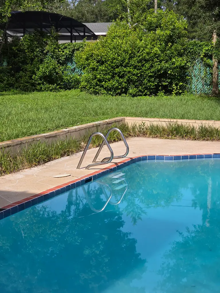 Residential pool edge and waterline detail after the interior finish work.