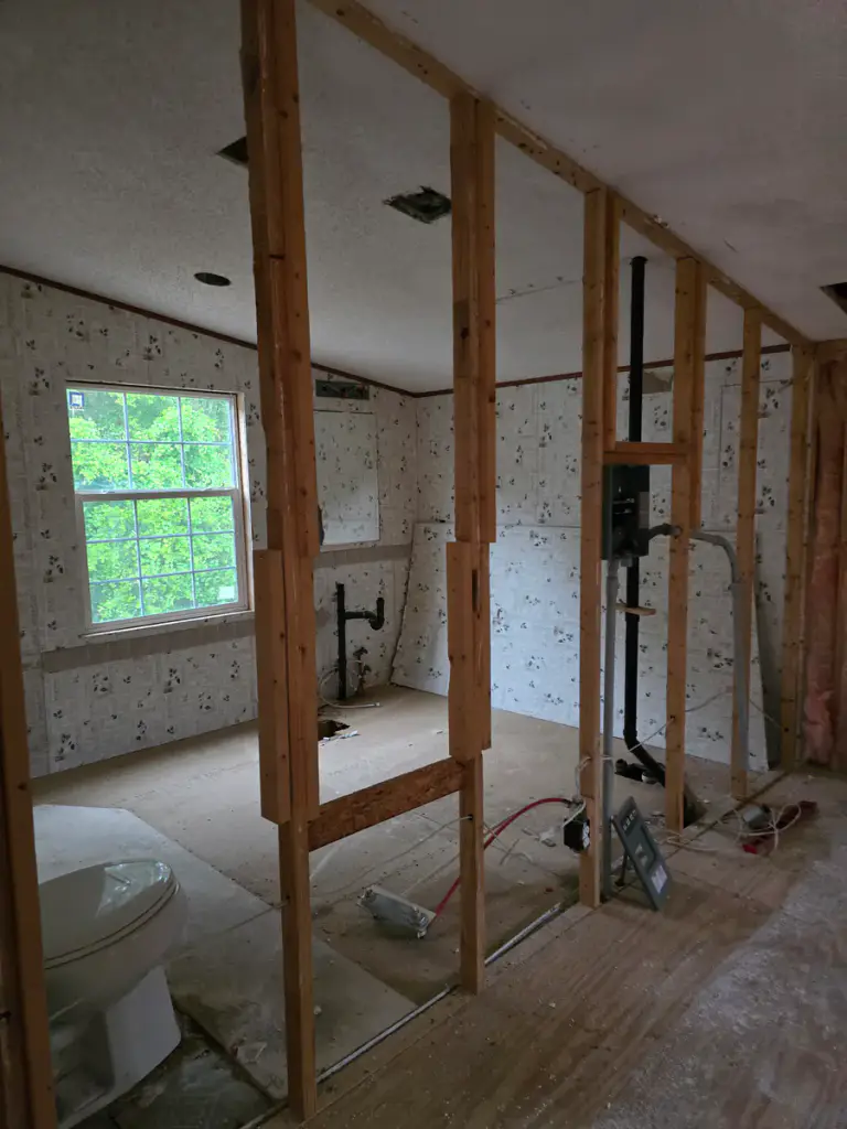 Interior partition framing and partially finished wall surfaces during renovation